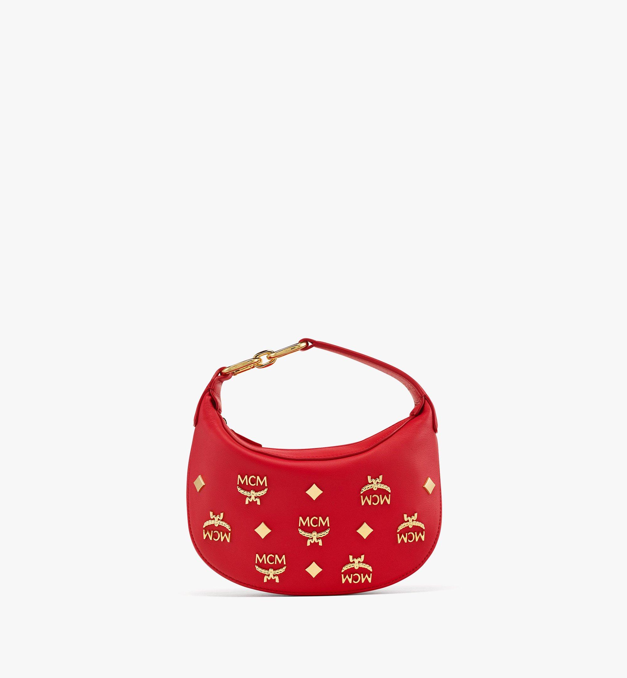 Sac hobo croissant Aren en cuir monogrammé doré 1